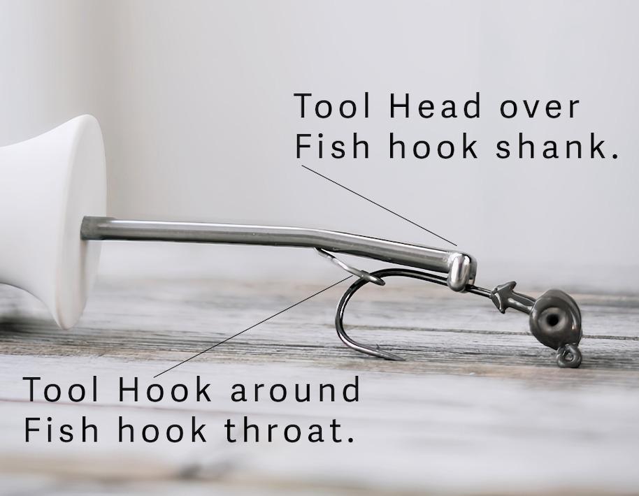 DHUKR tool head over fishhook shank and tool hook around fishhook throat