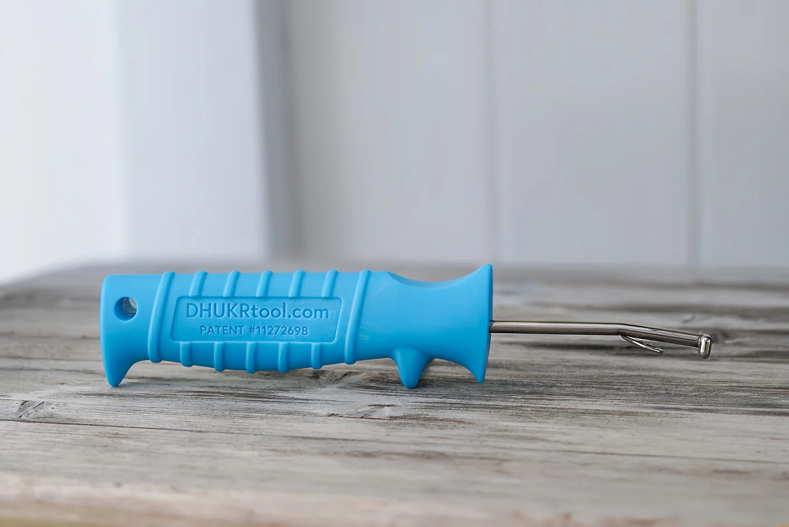 DHUKR tool shown on tabletop (blue)