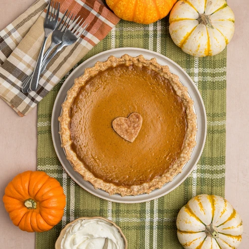 handcrafted Pumpkin Pie by SusieCakes, top it with fresh whipped cream view 1