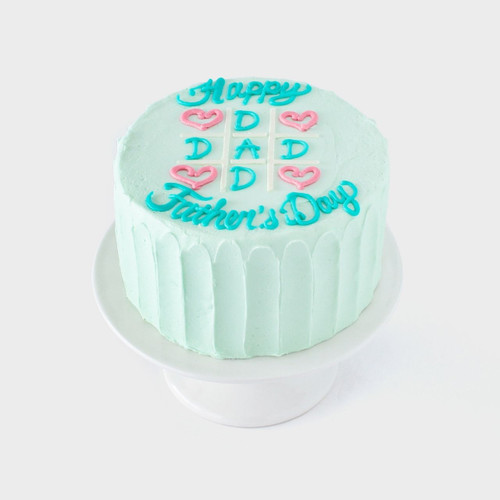 Tic-Tac-Toe Dad Vanilla Celebration Cake decorated with Father's Day themed buttercream design from SusieCakes view 2