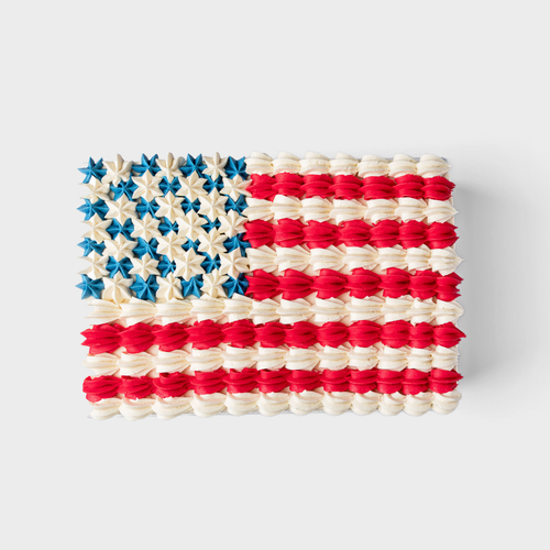 American Flag Sheet Cake decorated with hand-piped red, white, and blue buttercream in a patriotic flag design