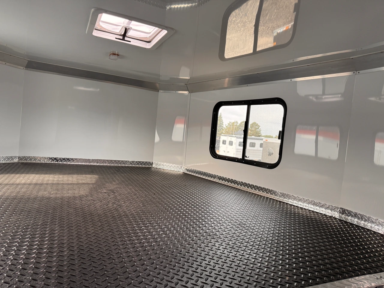 Charmac Trailers 2025 2025 336" Powersports Trailer | Tandem Axle Axle | Kitchen Base, Hydraulic Jack, Water Pkg, Shower Pkg, 30Amp Power Center, 14K Torsion W/ 2 Des Heaters