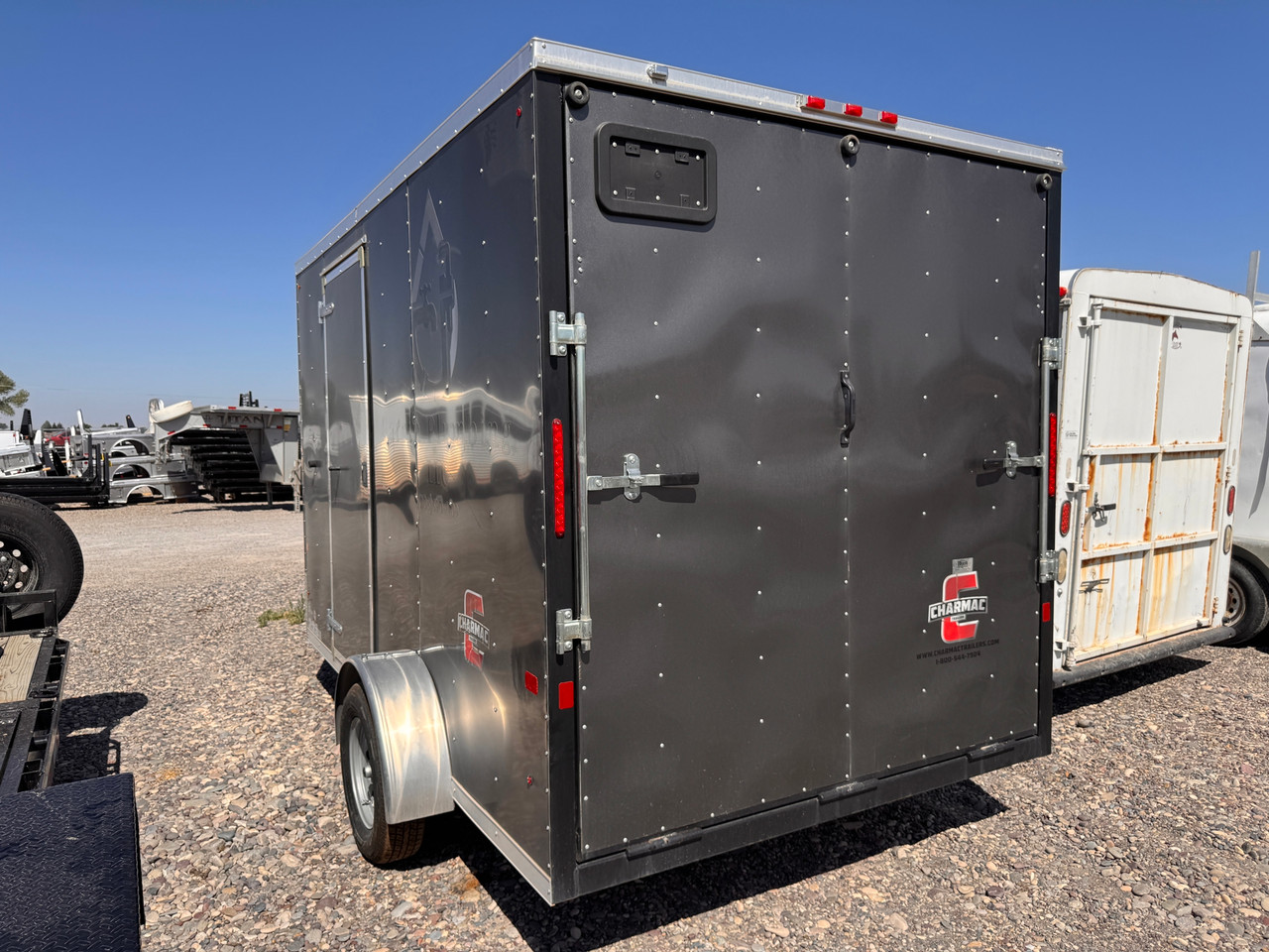 Charmac Trailers 2023 ATLAS 84"X12' V-Nose Cargo Trailer | Single Axle Axle 2.99K, Drivers Side Access Door, Smooth Alumium Fenders, Rear Ramp Door