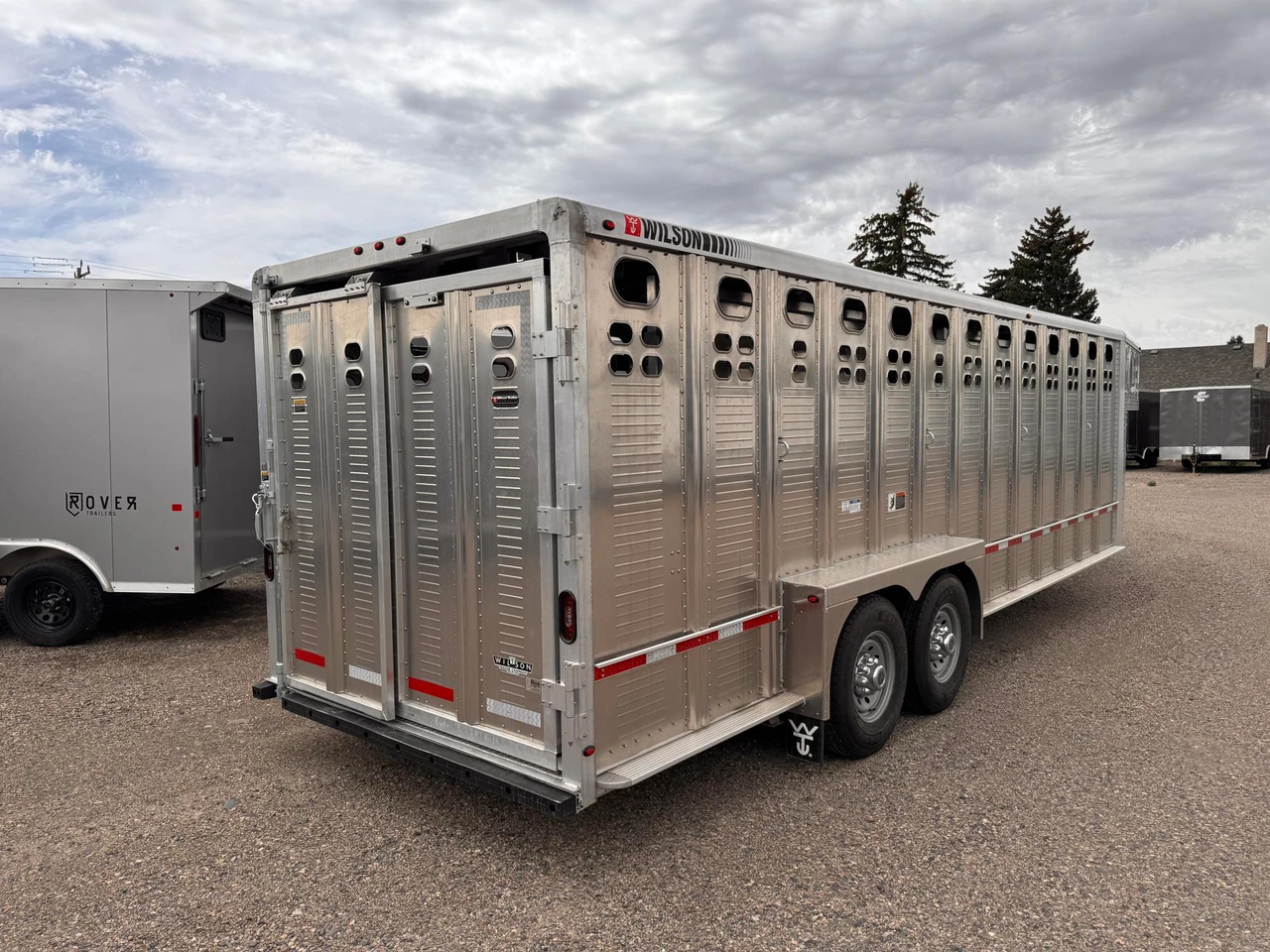 Wilson Trailers 2027 Punchside 84"X24' Stock Trailer | Alluminum, PSGN-5724, 16KGVWR, 7K AXLES, TIE RAIL INSIDE, 8 TIE LOOPS OUTSIDE, RUNNING BOARDS,