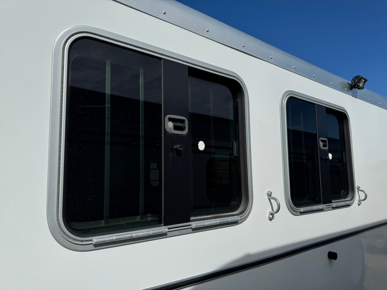 Triple C Trailers 2023 Teton Horse Trailer | 2H, SWING-OUT SADDLE RACK, DOOR ORGANIZER, EXT LOAD LIGHTS, WINDOWS, SPARE (charmac logo)