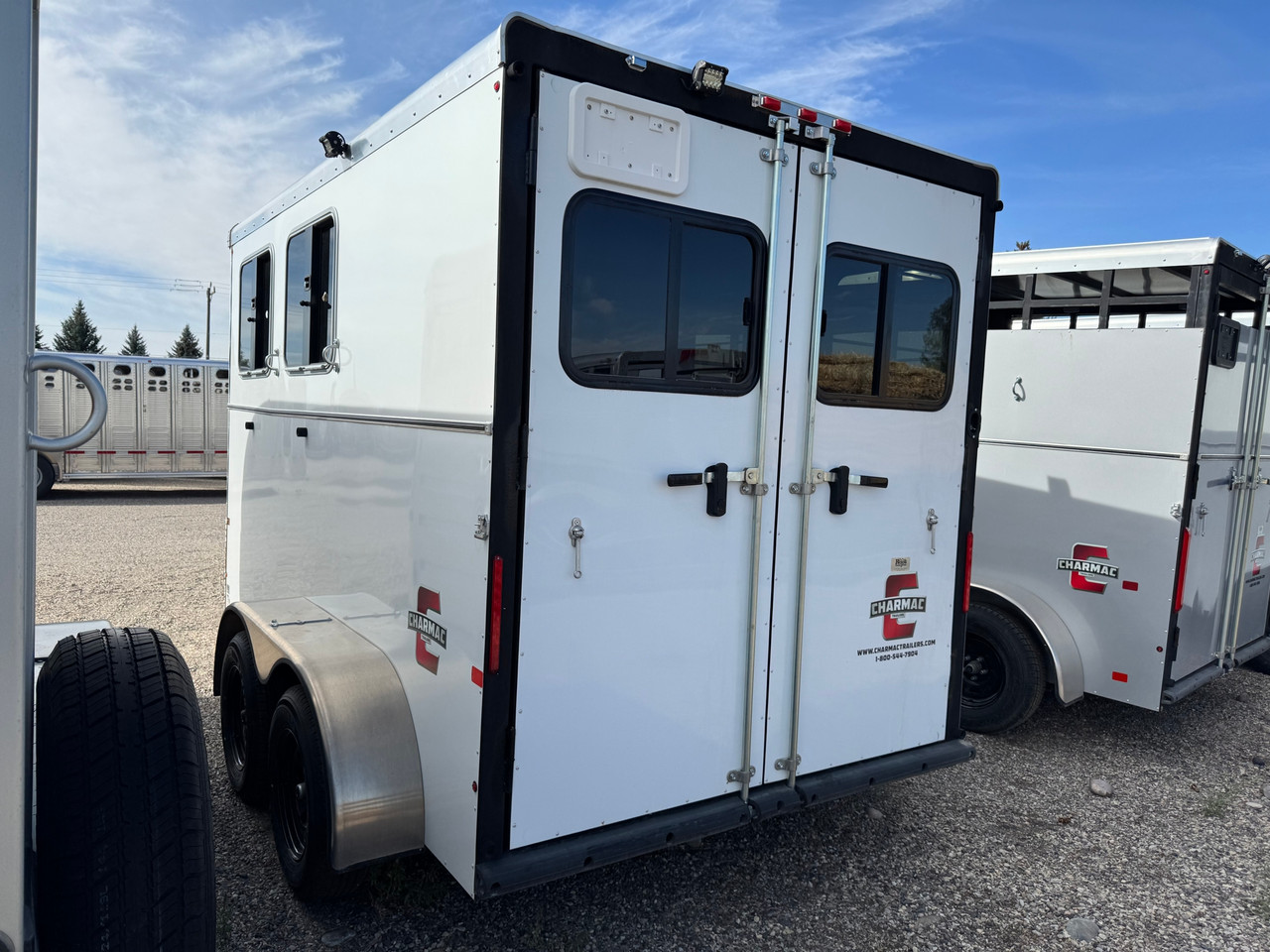 Triple C Trailers 2023 Teton Horse Trailer | 2H, SWING-OUT SADDLE RACK, DOOR ORGANIZER, EXT LOAD LIGHTS, WINDOWS, SPARE (charmac logo)