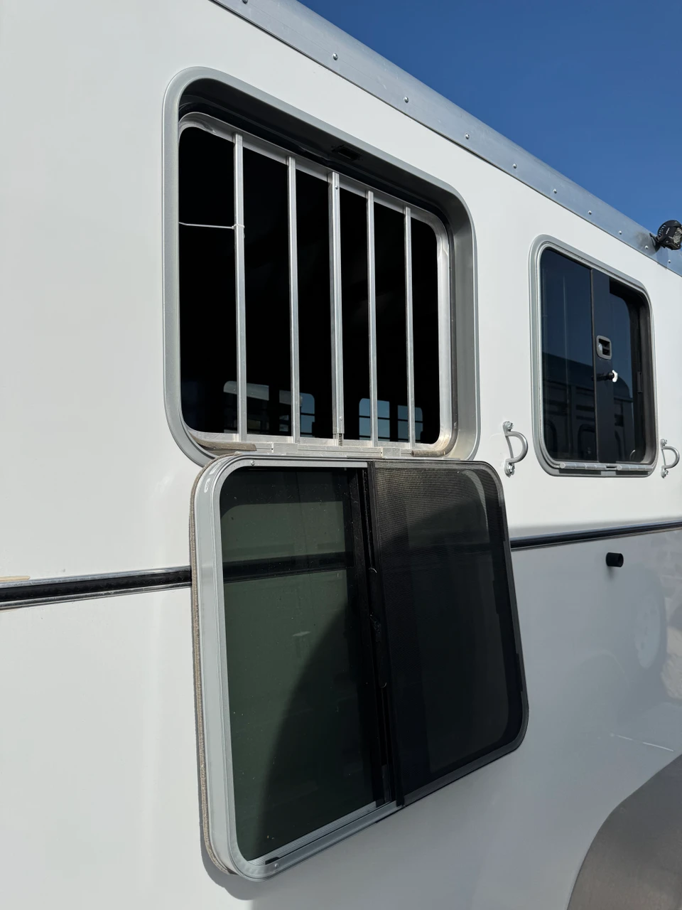 Triple C Trailers 2023 Teton Horse Trailer | 2H, SWING-OUT SADDLE RACK, DOOR ORGANIZER, EXT LOAD LIGHTS, WINDOWS, SPARE (charmac logo)