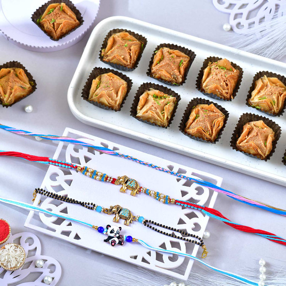 Pack of 4 Designer Rakhis with Baklawa Sweet