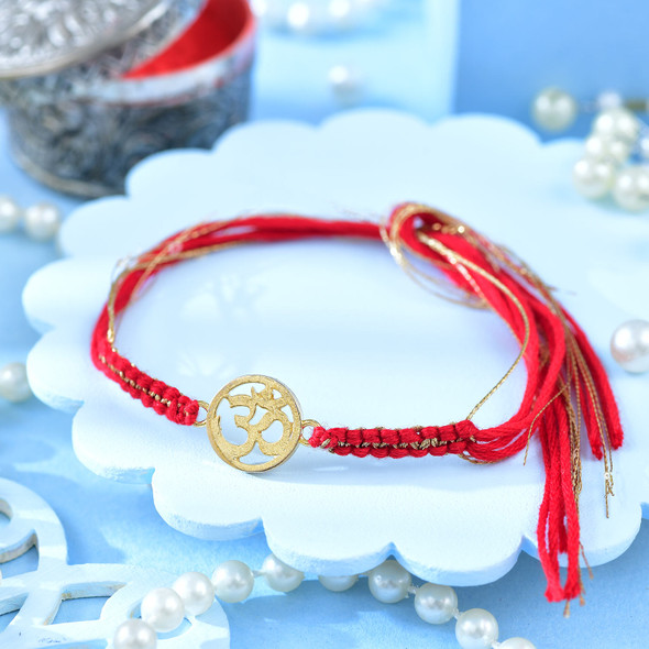 Gold Plated Divine Om Rakhi with Dry Fruit & Sweet Hamper