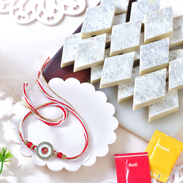 Elegant Om Circular Rakhi with Kaju Katli