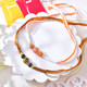 Elegant Set of 2 Beaded Rakhi with Tiger’s Eye and Peach Beads