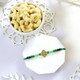 Elegant Beaded Rakhi with Green Thread With Cashew
