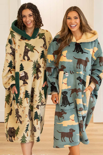 two woman wearing blanket hoodies