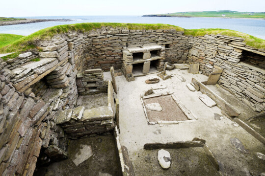 Skara Brae Stone Age Neolithic village in Scotland. Interior with box beds, hearth and dresser
