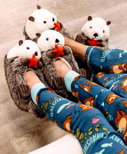 two people wearing critter slippers