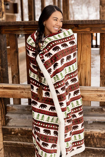 woman wrapped in a sherpa throw blanket