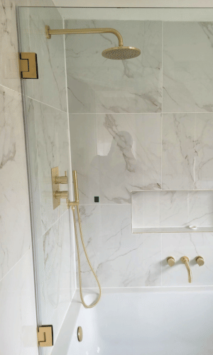 Custom Shower Enclosure Bespoke shower Door in Satin Brass with a white bathroom