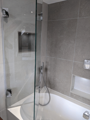 Custom Bifolding shower door over bath