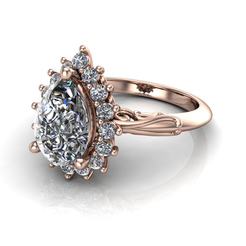 pear diamond engagement ring worn on finger front view