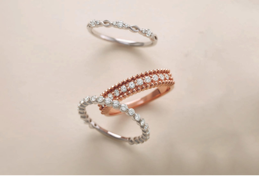 women’s diamond wedding rings on white and rose gold settings