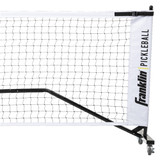 Black and white Franklin Pickleball Portable Net System with wheels and a durable steel frame is easy to set up and move around. Includes black weather-resistant carrying and storage bag.