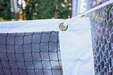 Lightweight Pickleball Net, black mesh netting with white headband, easily ties to existing standards.