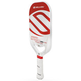 The Selkirk VANGUARD Power Air Invikta Paddle is available in white, with your choice of red or black accent color options, and one weight. Features aerodynamic opening in the throat, and Selkirk logo and model name across the textured paddle face.