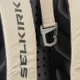 Close up view of the Selkirk PRO Performance Tour Pickleball Backpack logo in the color Raw White.