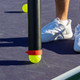 GAMMA Pickleball Ball Tube is a collapsible ball retrieval tube that when expanded stores 12 pickleballs. Black, red, and white with the GAMMA logo on the side.