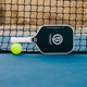 Katanashot XL Paddle by Oneshot Pickleball featuring a black carbon face and white logo, edge guard, and grip