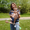 Riley holding Flower Pig Weather Vane for Size Reference