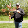 Todd Holding Rooster Weather Vane for Size Reference