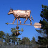 Large Cow with Horns Weathervane left side view with blue sky background
