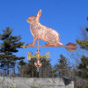Rabbit Weathervane left side view on blue sky background