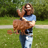Riley holding Pig and Rooster Weathervane for Size Reference