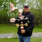 Todd holding Hummingbird and Flower Weather Vane for Size Reference