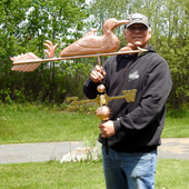 Todd Holding Loon and Chicks Weather Vane for Size Reference