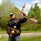 Todd Holding Large Victorian Arrow Weather Vane for Size Reference