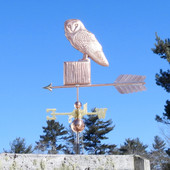 barn owl weathervane on a post