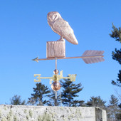 barn owl weathervane on a post