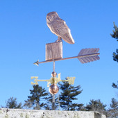 barn owl weathervane on a post