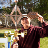 Todd holding a Traditional Handcrafted Copper Diamond Arrow Weathervane