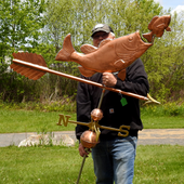 Todd Holding Large Bass Weather Vane for Size Reference