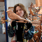 Riley holding Cardinal Weathervane for Size Reference