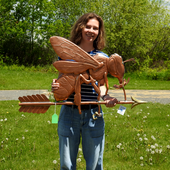 Riley holding Bee Weather Vane for Size Reference
