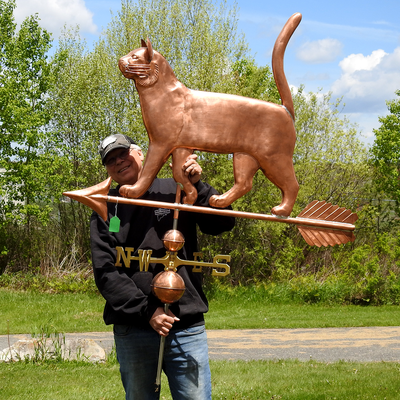 Todd holding Large Cat Weathervane for Sizing