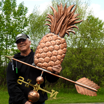 Todd Holding Grand Pineapple Weather Vane for Size Reference