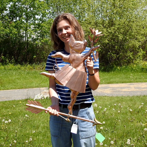 Riley holding Flower Pig Weather Vane for Size Reference