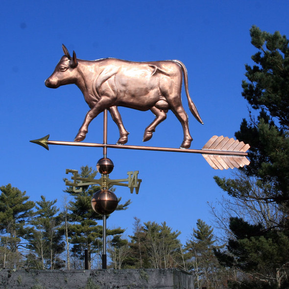 Large Cow with Horns Weathervane left side view with blue sky background