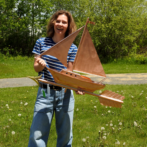 Riley holding Sailboat weathervane for Size Reference